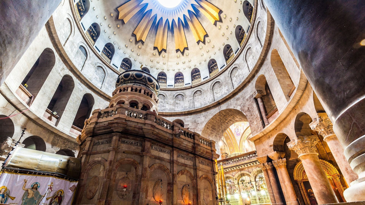 Interior view of the Church of the Holy Sepulchre in Jerusalem, showing the ornate golden dome above the Edicule, the shrine built over the traditional site of Jesus' tomb